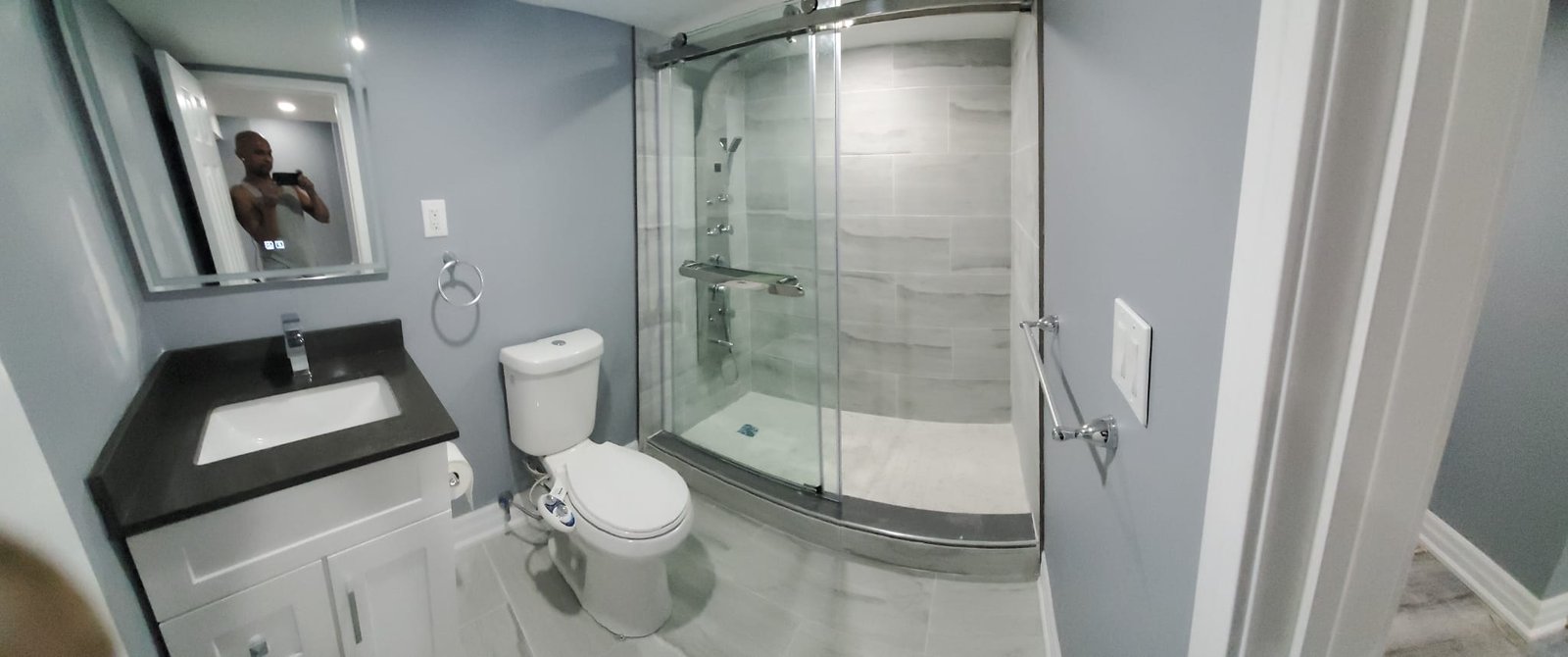 Modern bathroom with frameless glass shower and floating vanity